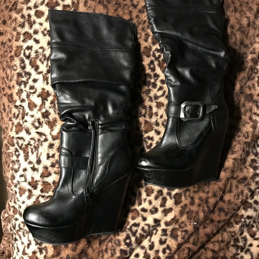 Black high wedge boots